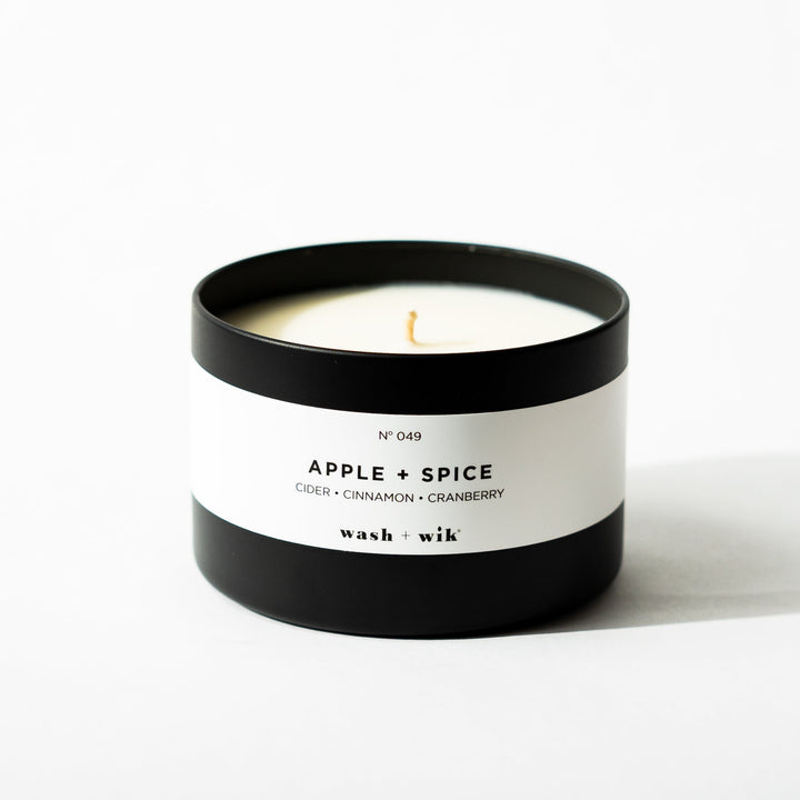 Black tin candle on white background