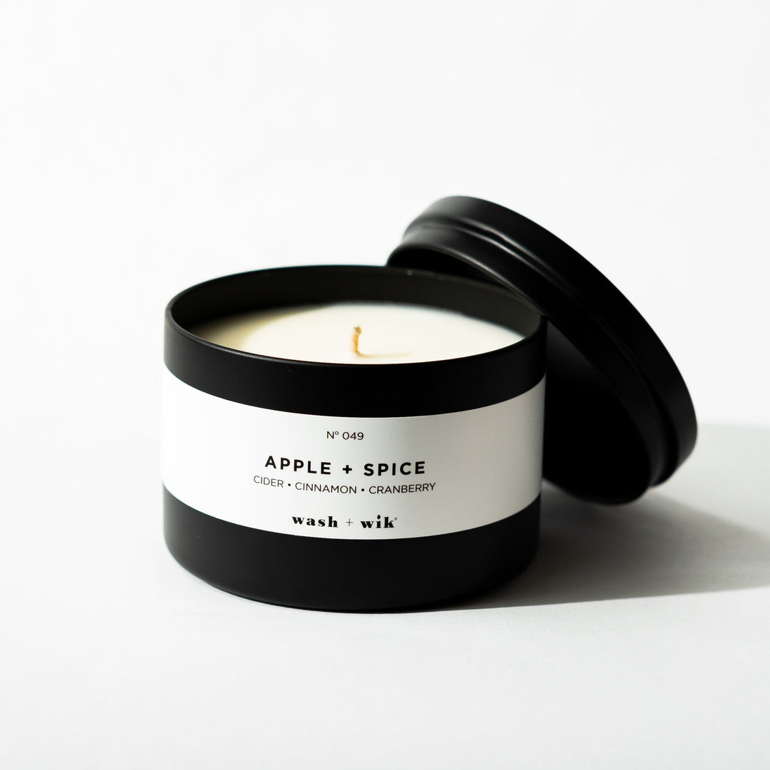 Black tin candle on white background