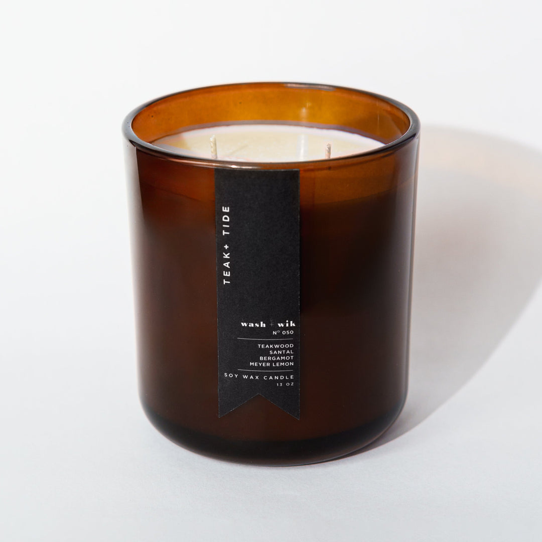 Brown candle with a label on a white background