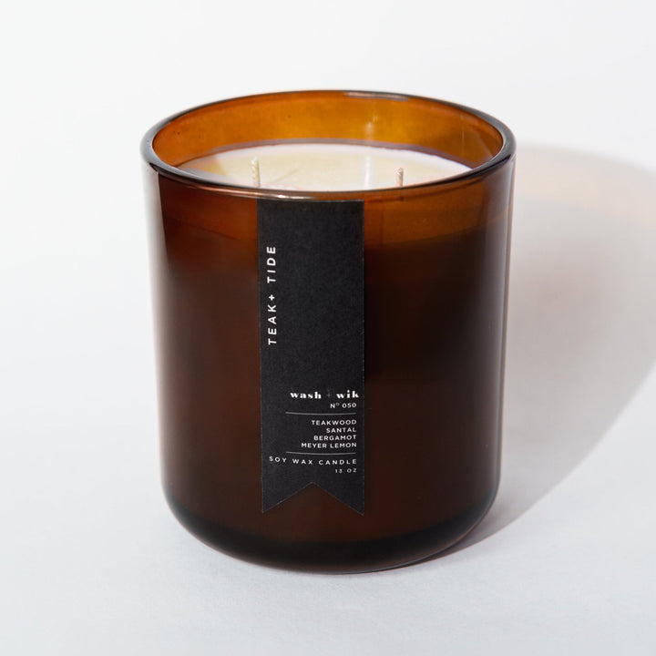 Brown candle with a label on a white background