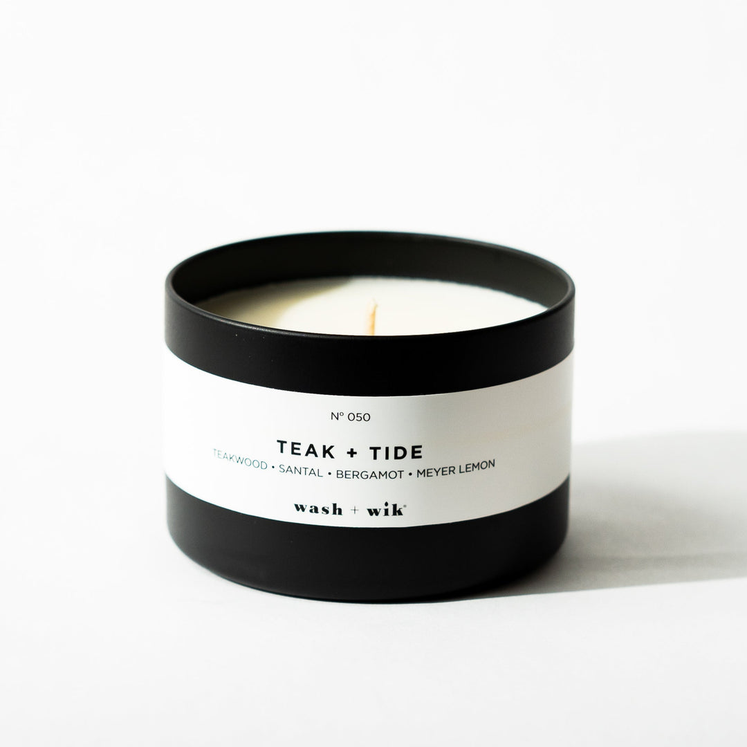 Black tin candle on white background
