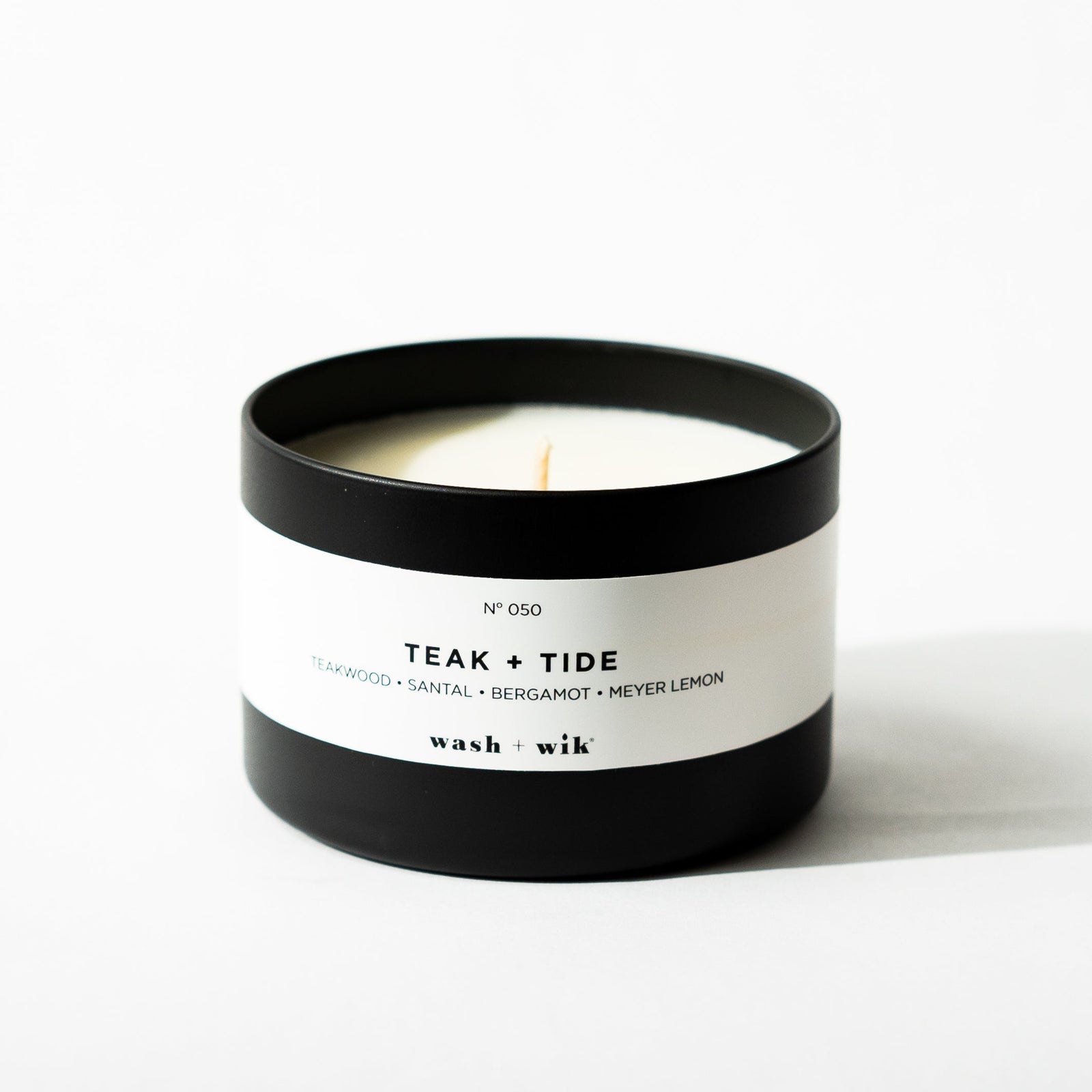 Black tin candle on white background