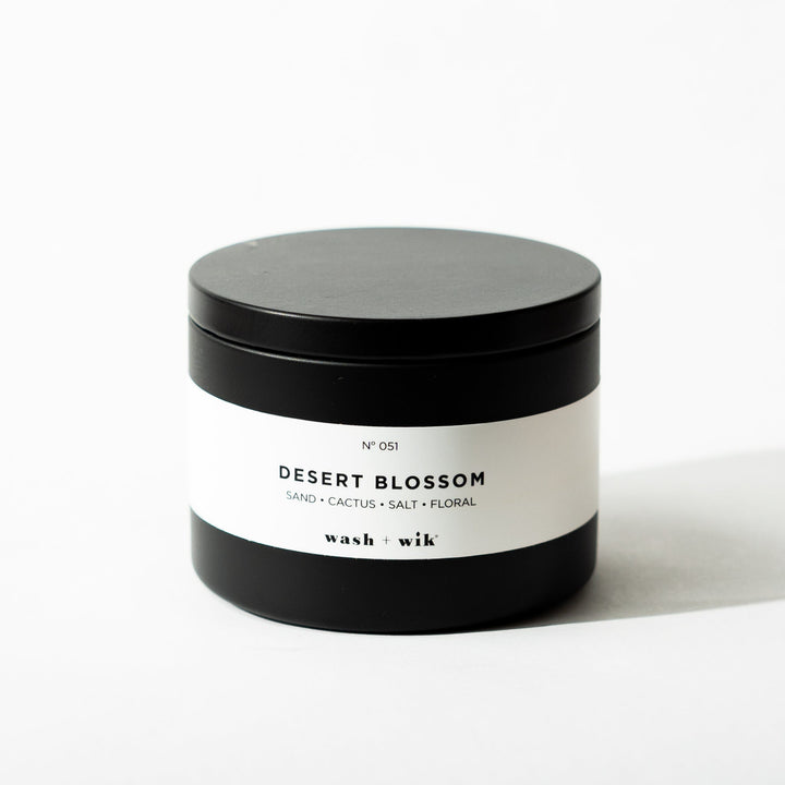 Black tin candle on white background