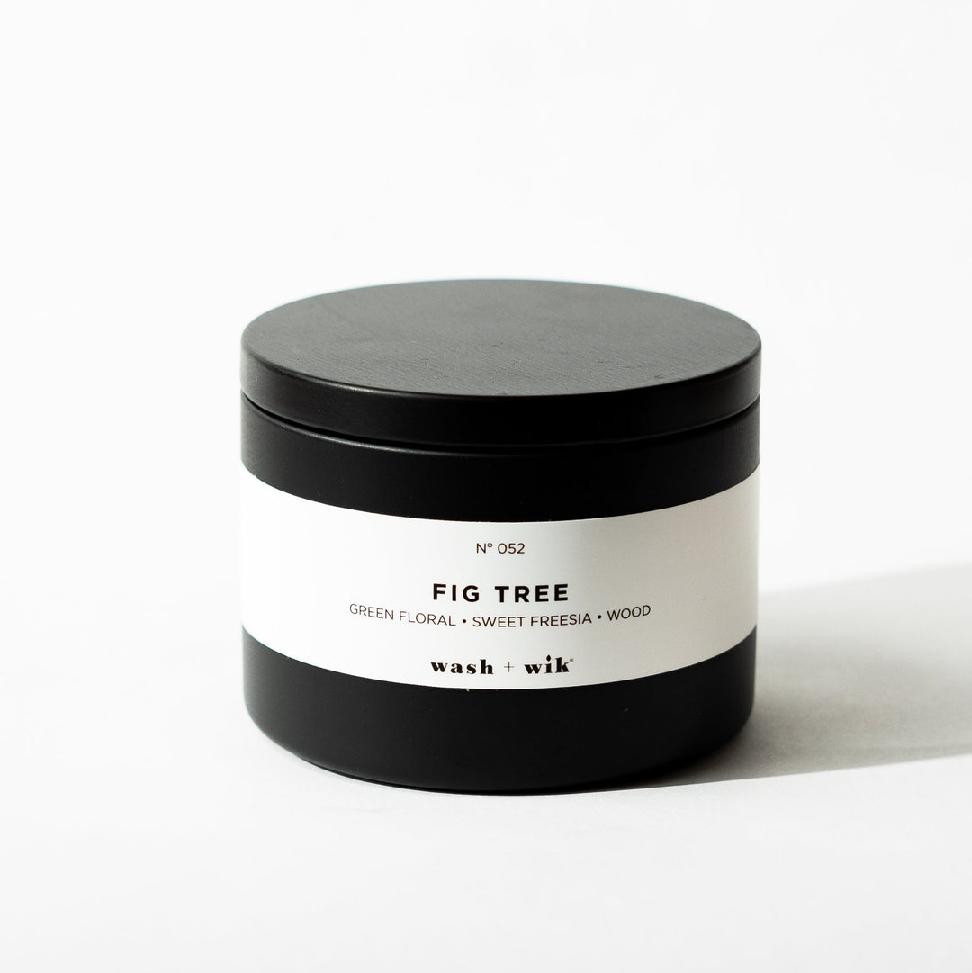 Black tin candle on white background