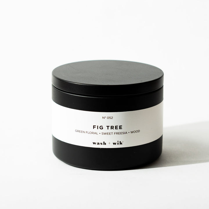 Black tin candle on white background