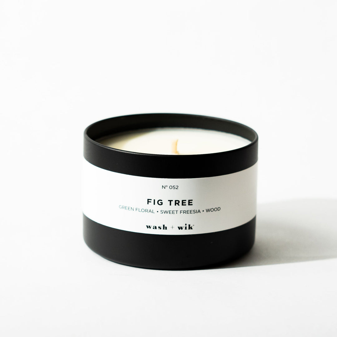 Black tin candle on white background
