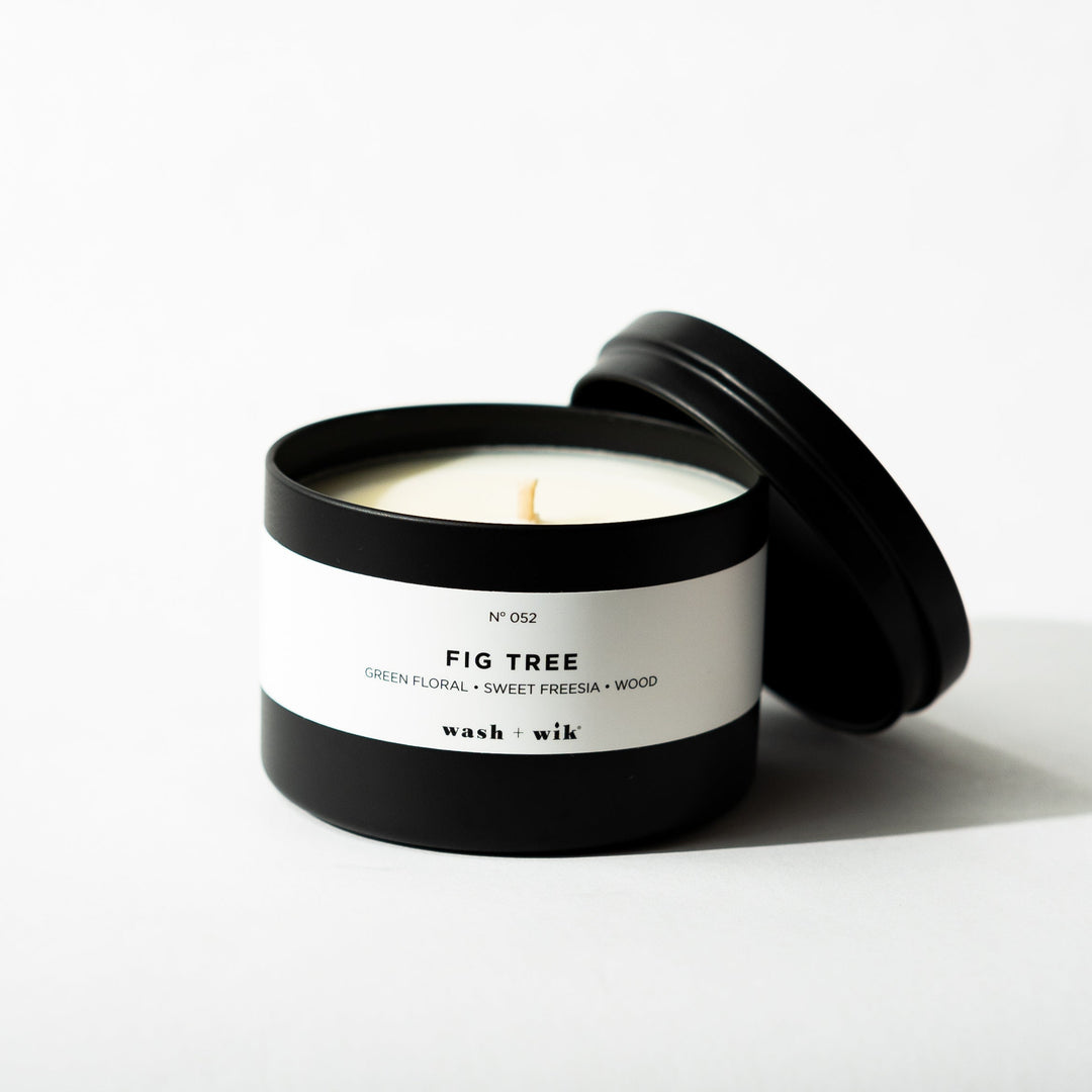 Black tin candle on white background