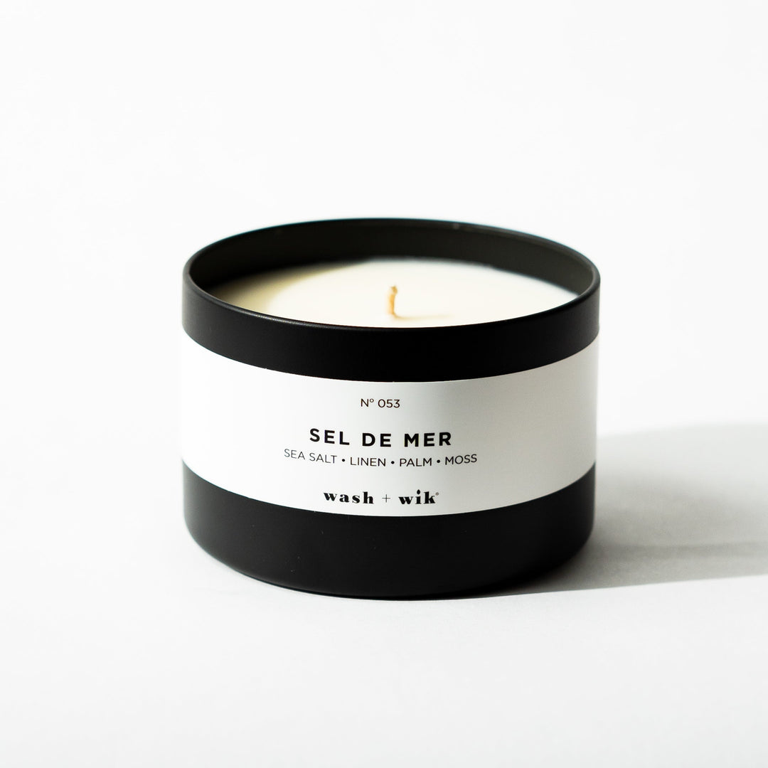 Black tin candle on white background