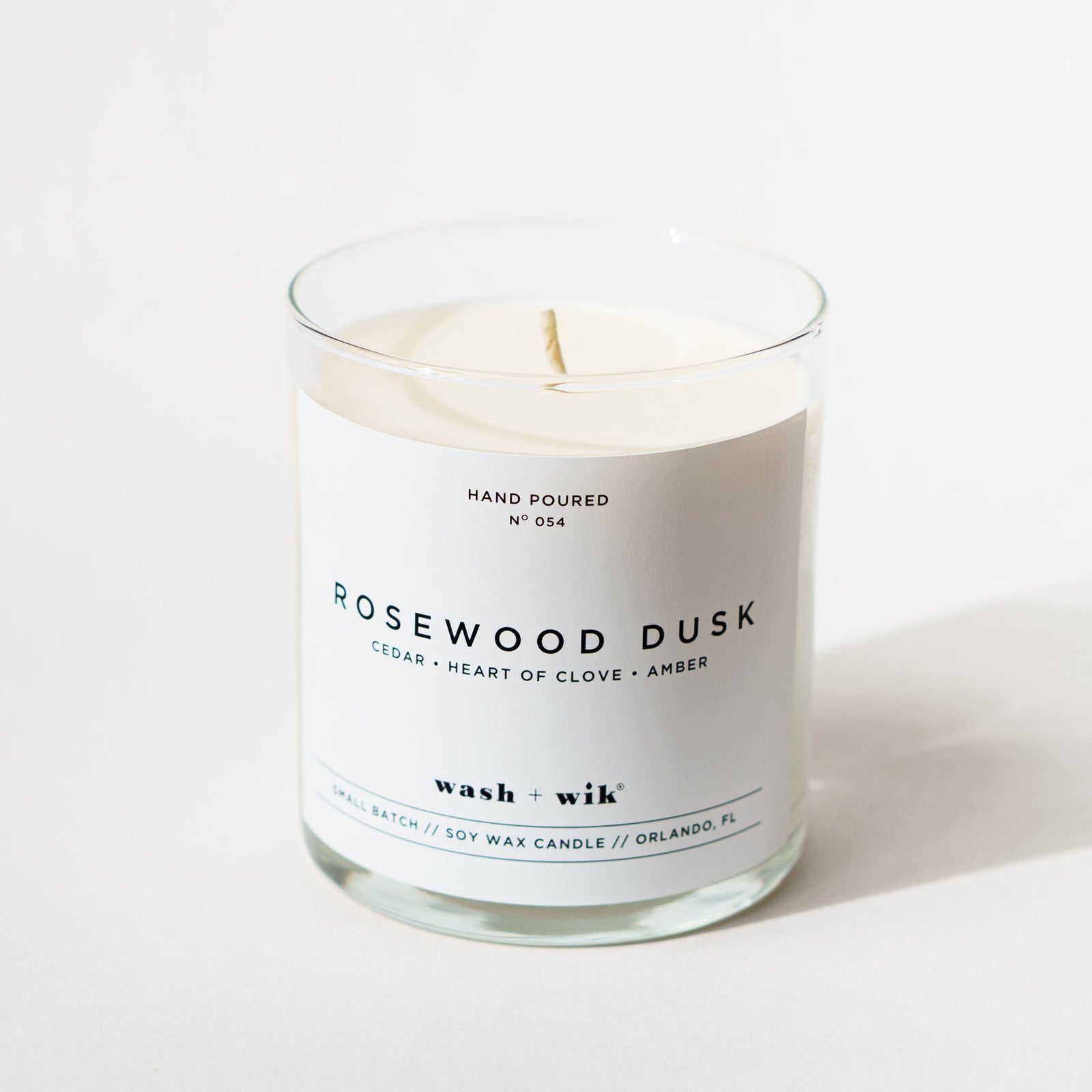 single wick candle that says rosewood dusk on a white background