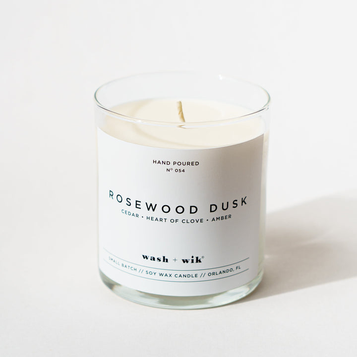 single wick candle that says rosewood dusk on a white background