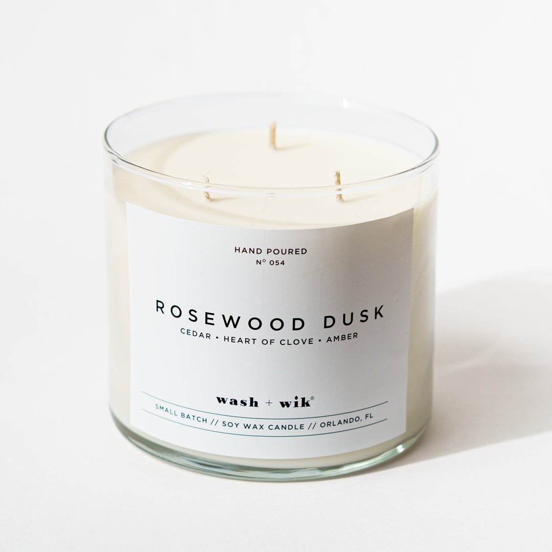 3 wick candle with a white background