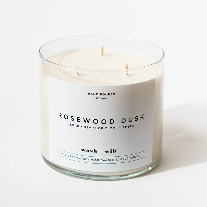 3 wick candle with a white background