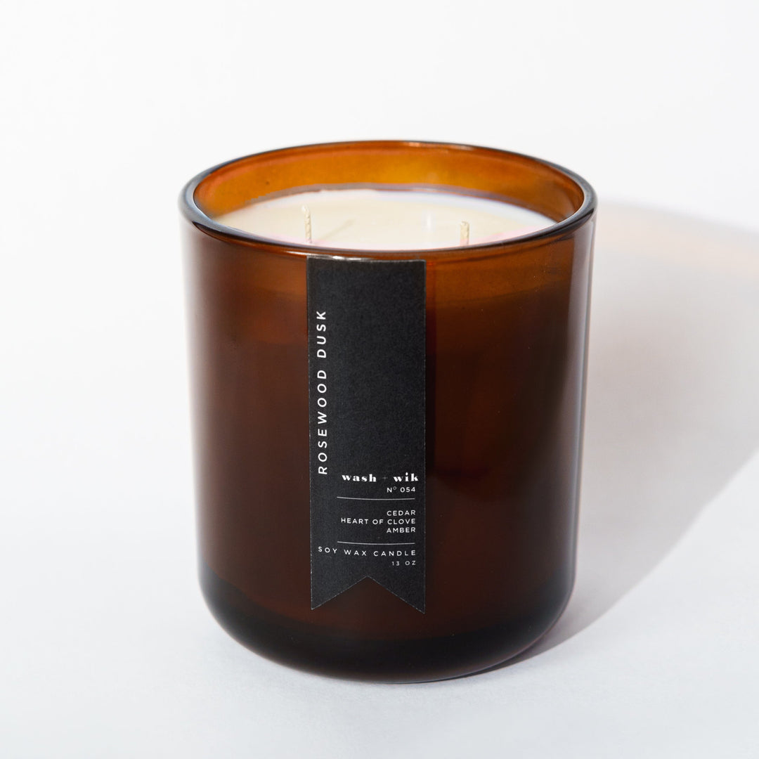 Brown candle with a label on a white background