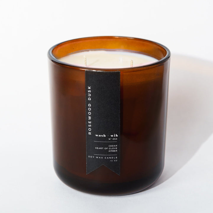 Brown candle with a label on a white background