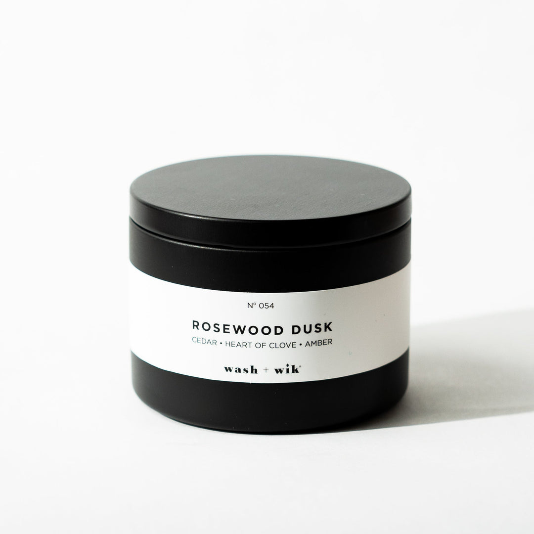 Black tin candle on white background