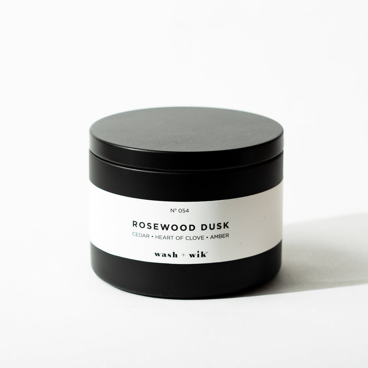 Black tin candle on white background