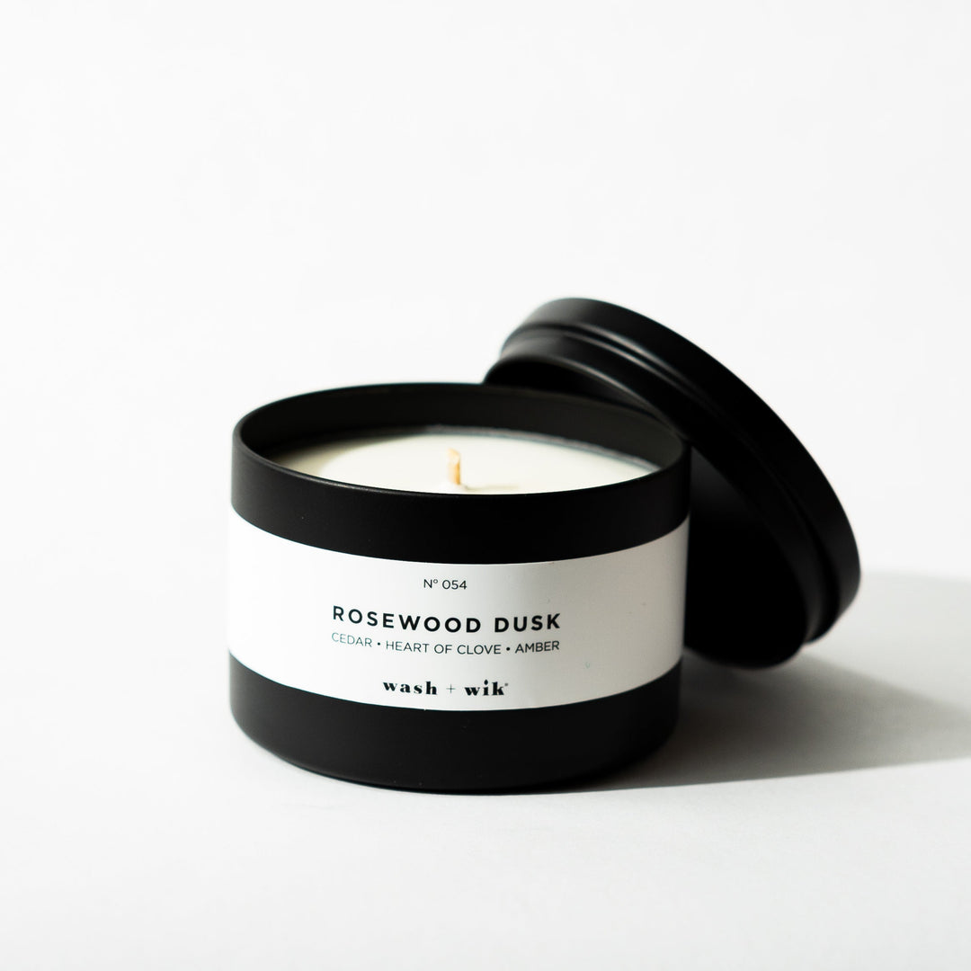 Black tin candle on white background