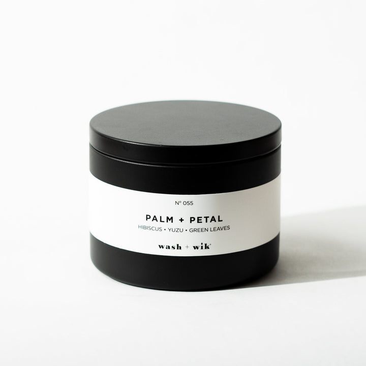Black tin candle on white background
