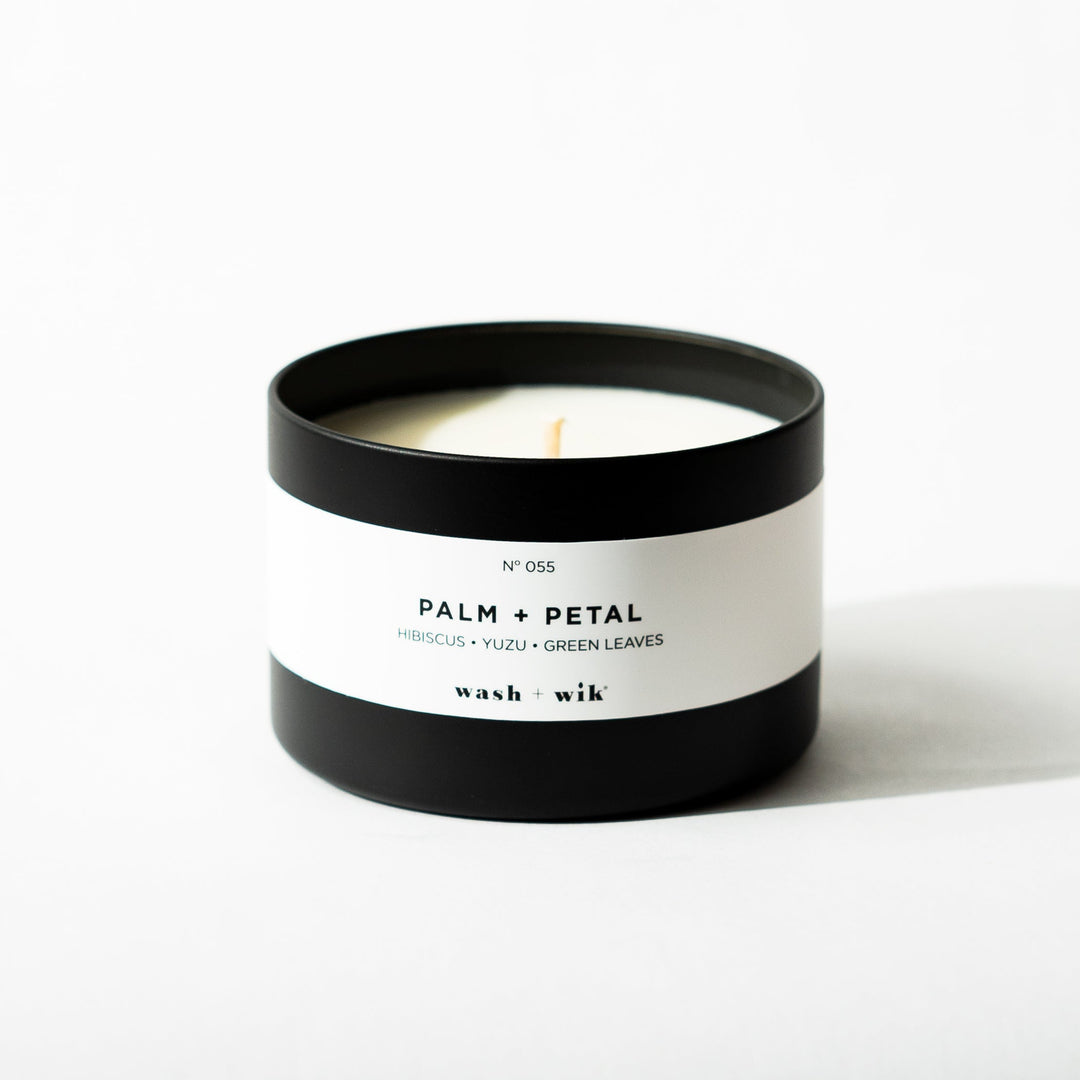 Black tin candle on white background