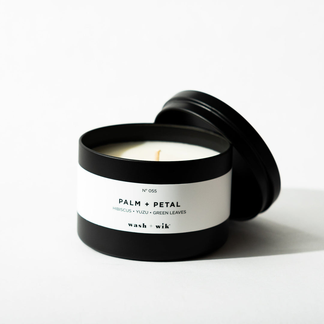 Black tin candle on white background