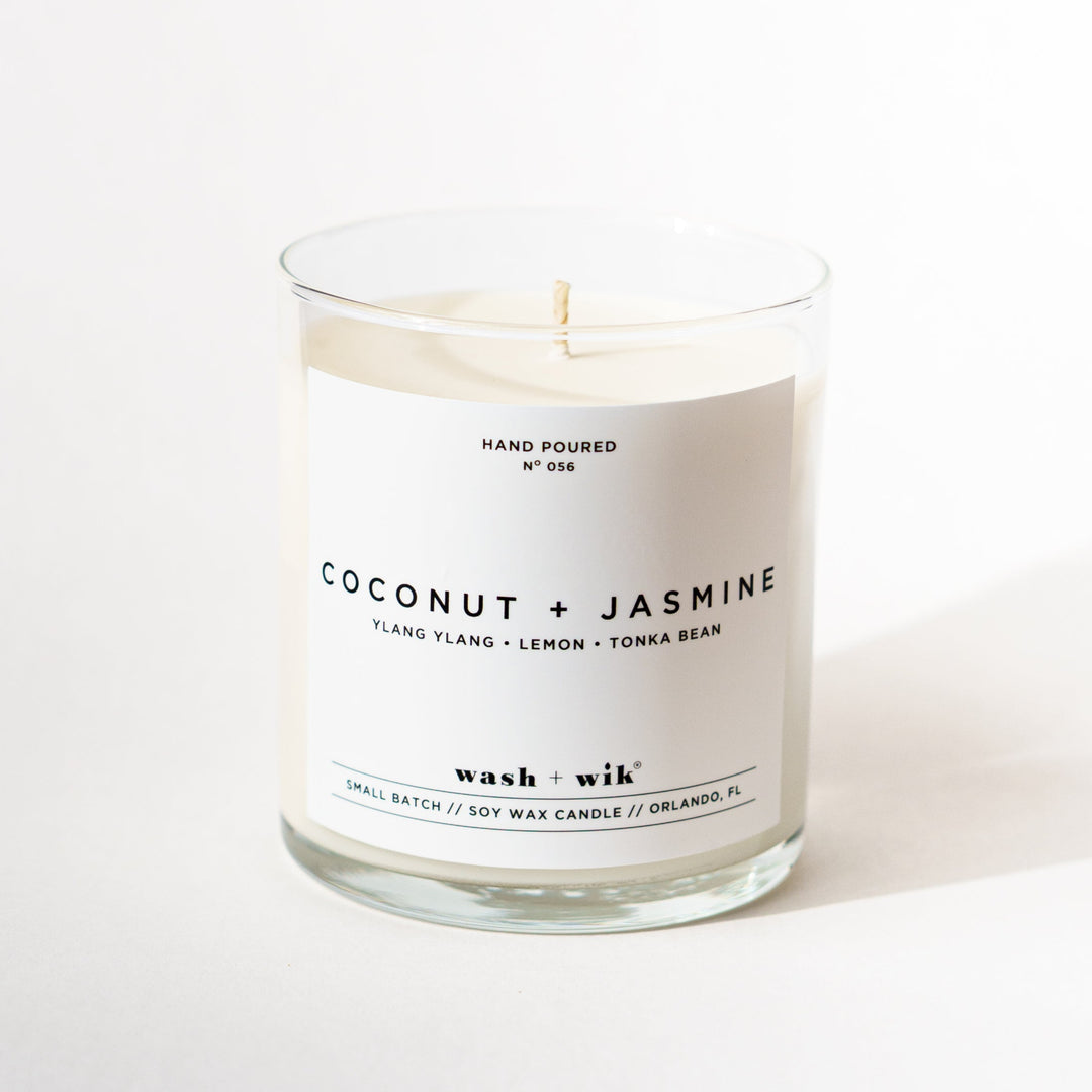 Single wick candle with a white label and a white background