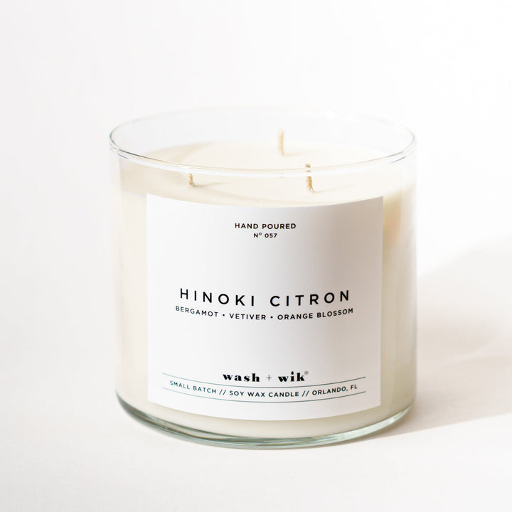 Large 3 wick candle with a white label and a white background