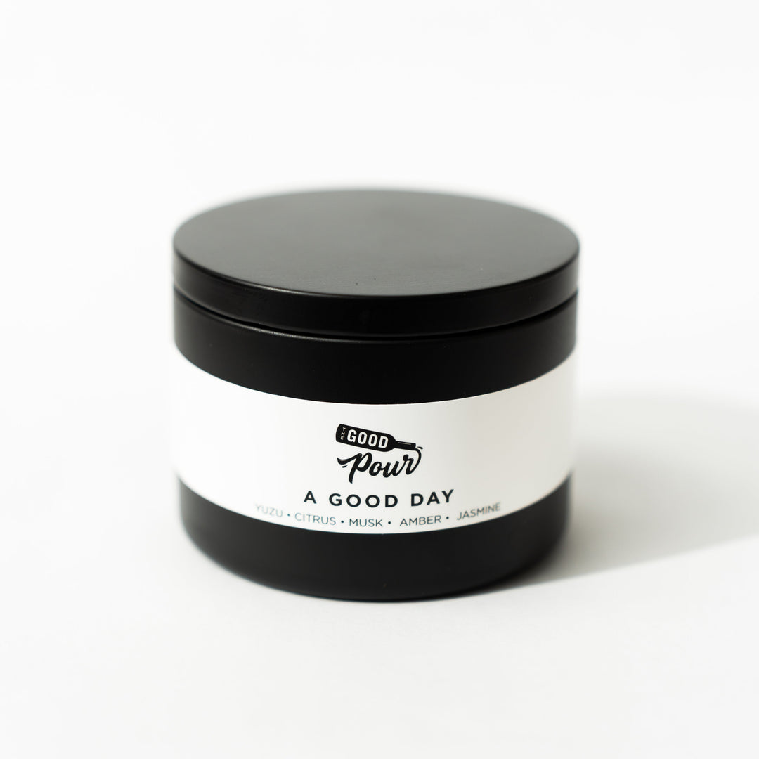 black tin candle with white background 