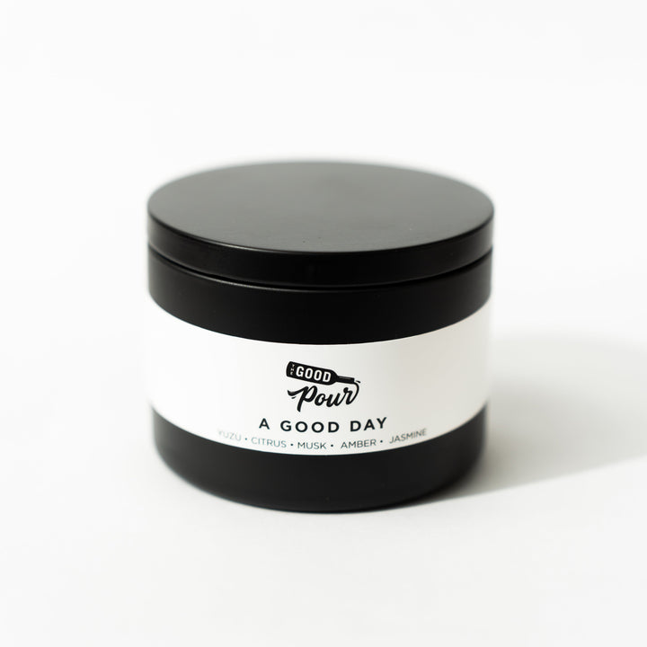 black tin candle with white background 