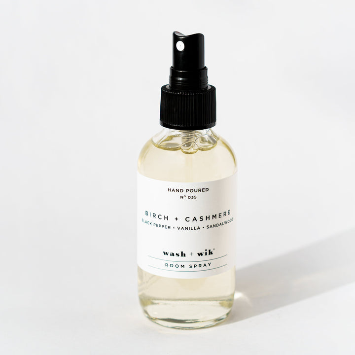Clear room spray bottle on a white background 