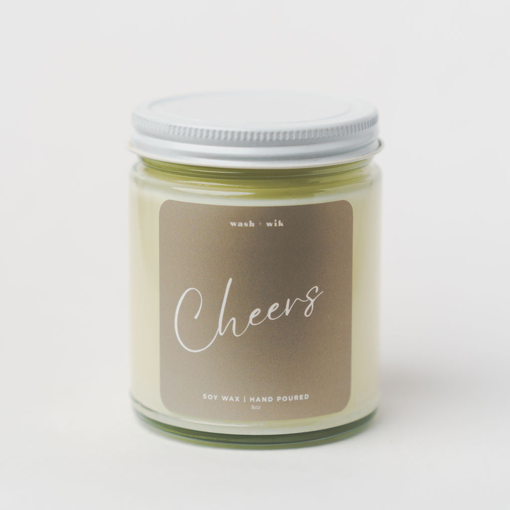 Candle jar with a label reading &