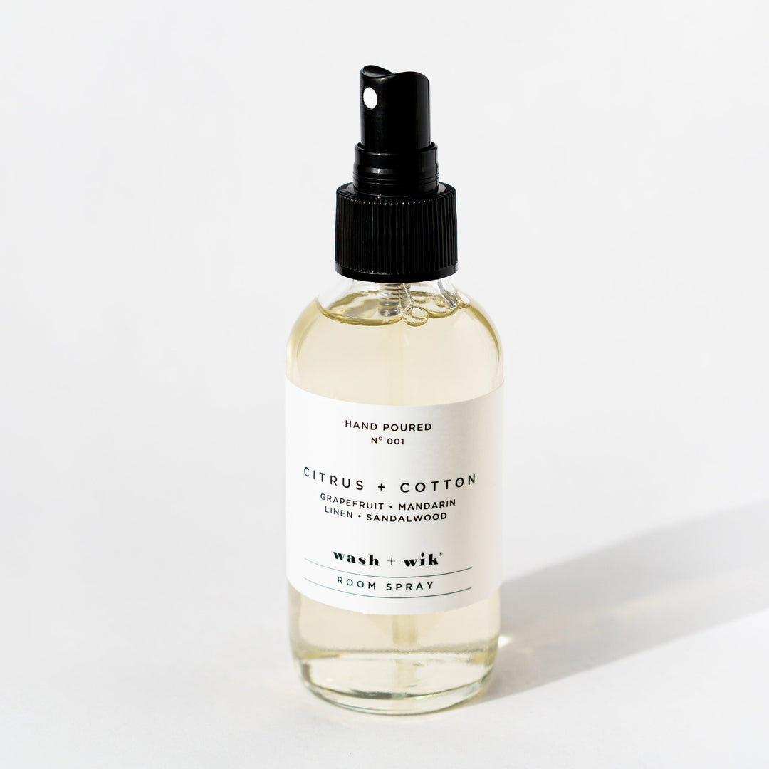 Clear room spray bottle on a white background 
