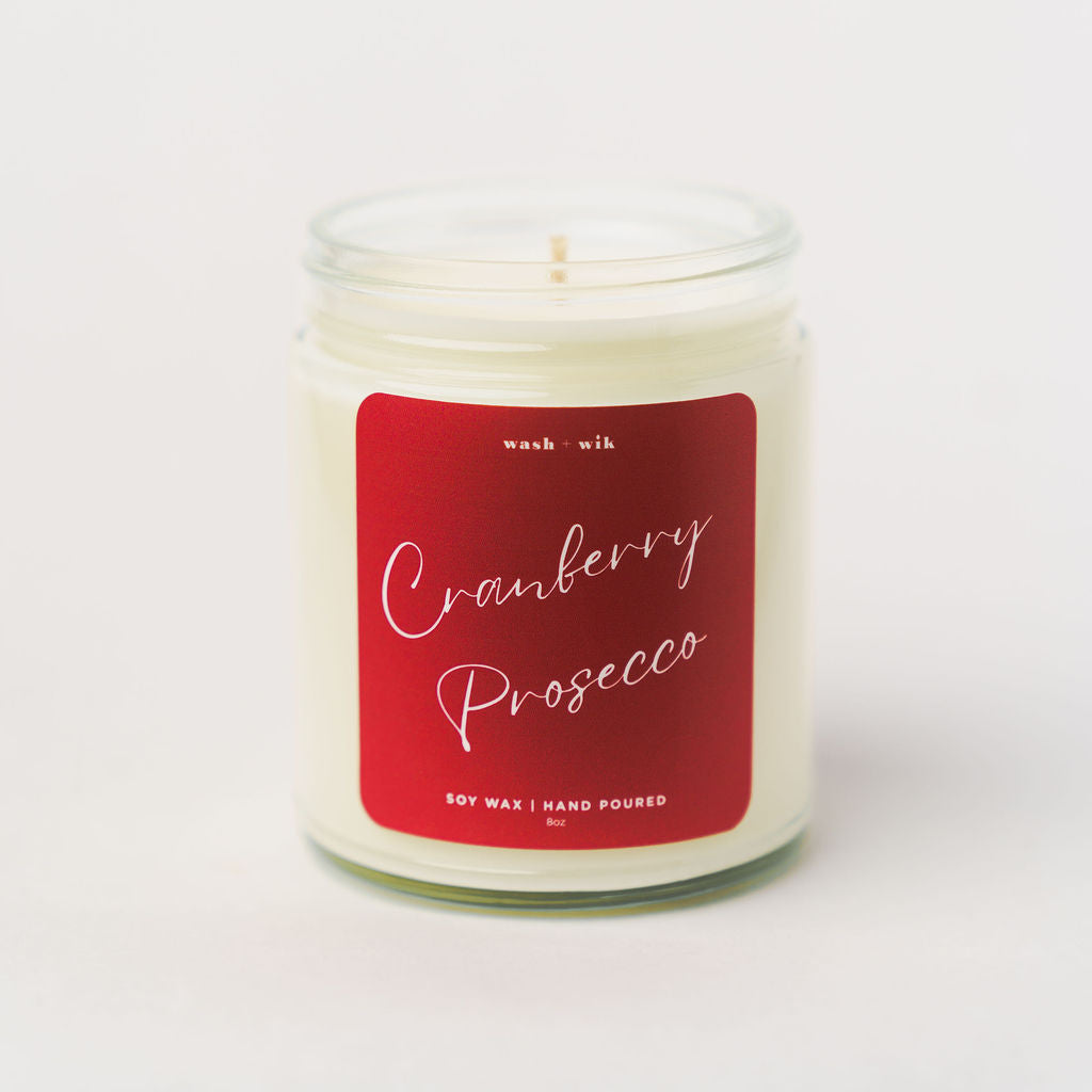 Candle with a red label on a white background