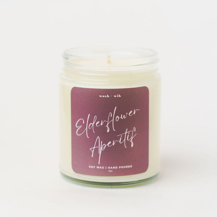 Candle with a purple label on a white background