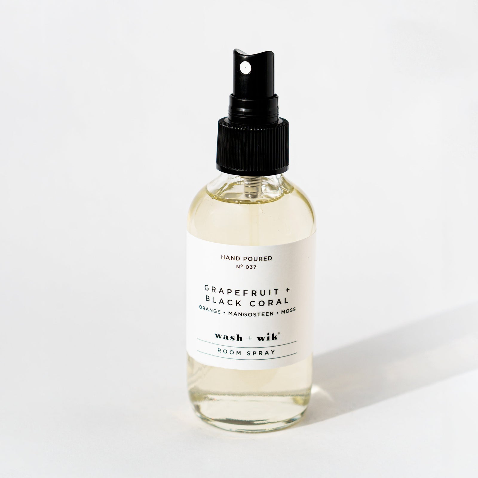Clear room spray bottle on a white background 