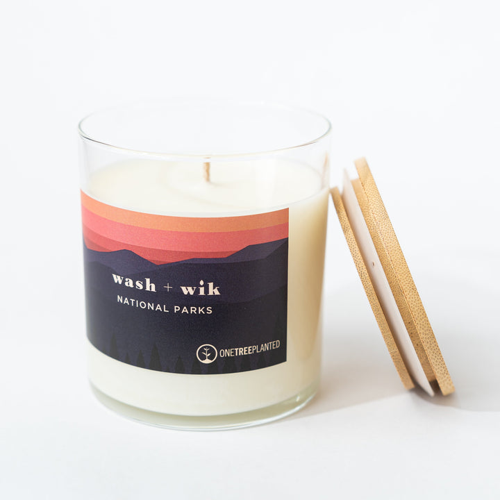 Candle with a labeled lid on a white background