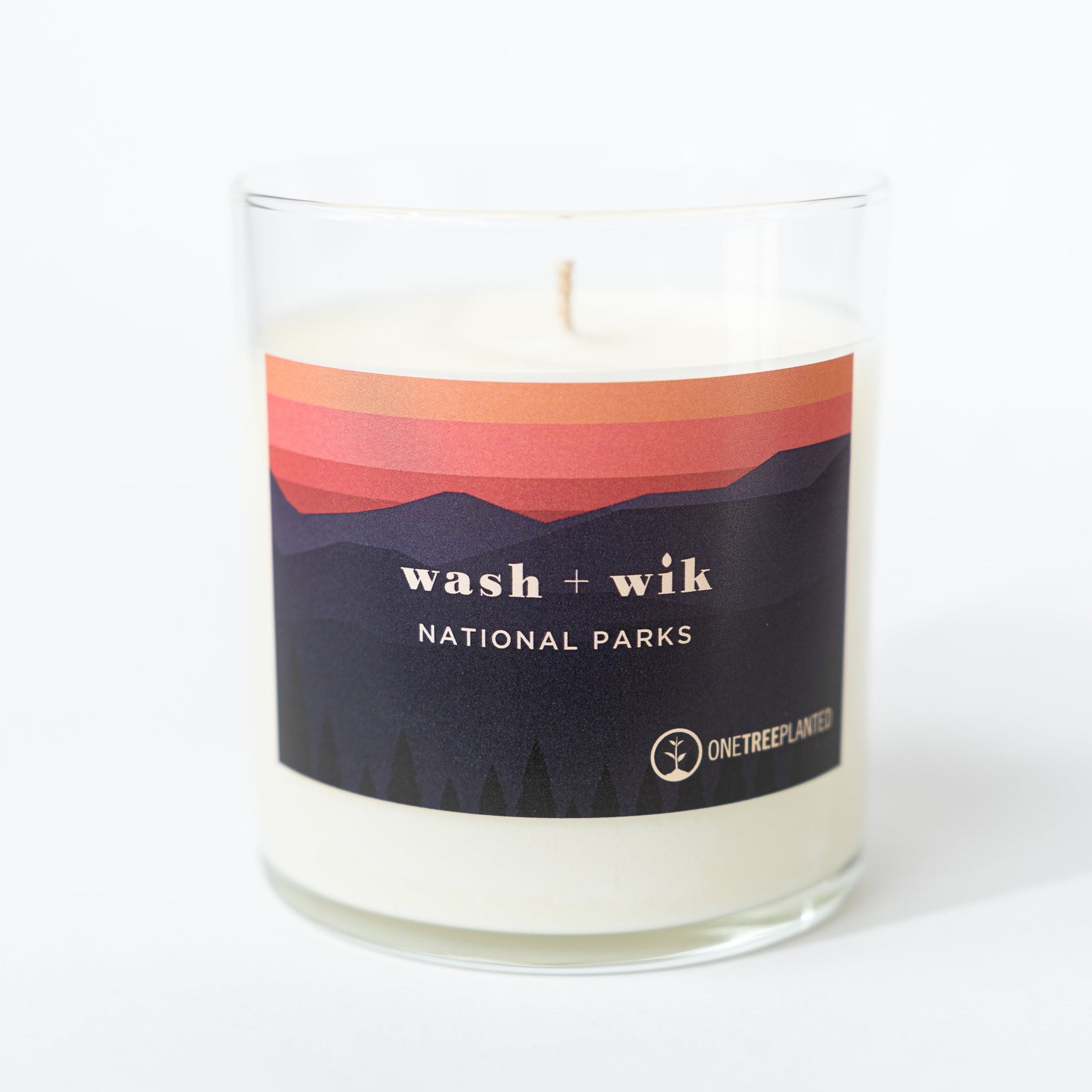 Candle with a 'wash + wik National Parks' label on a white background
