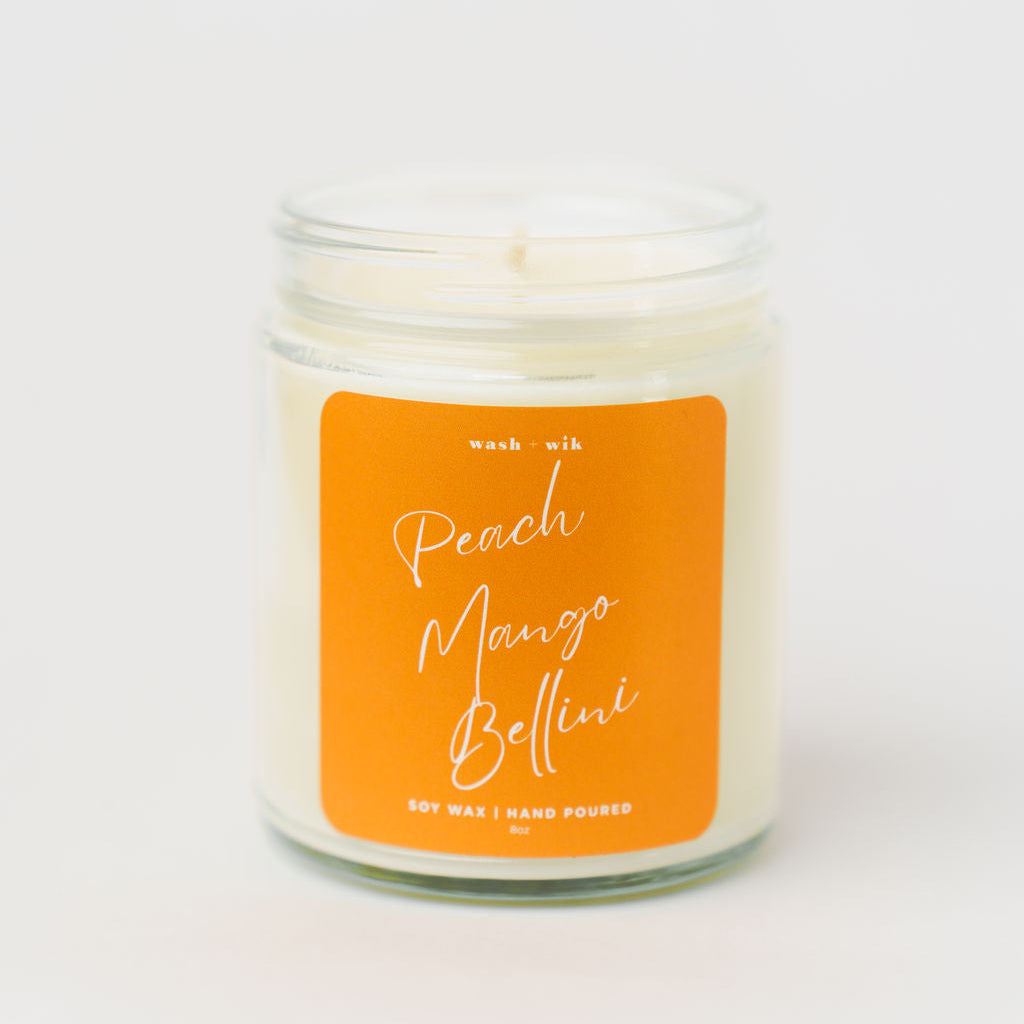 Candle with an orange label on a white background