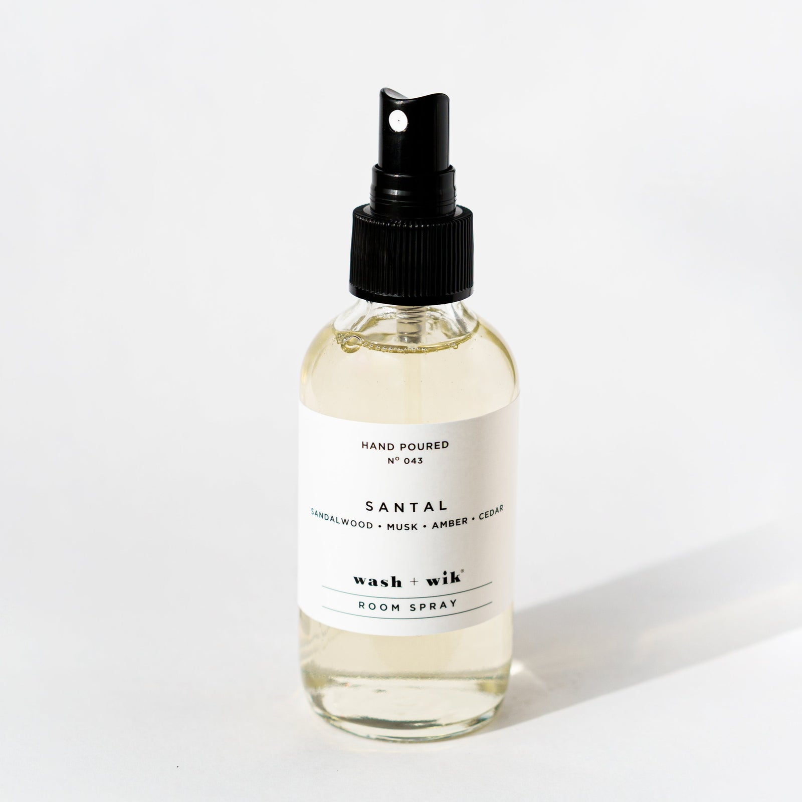 Clear room spray bottle on a white background 