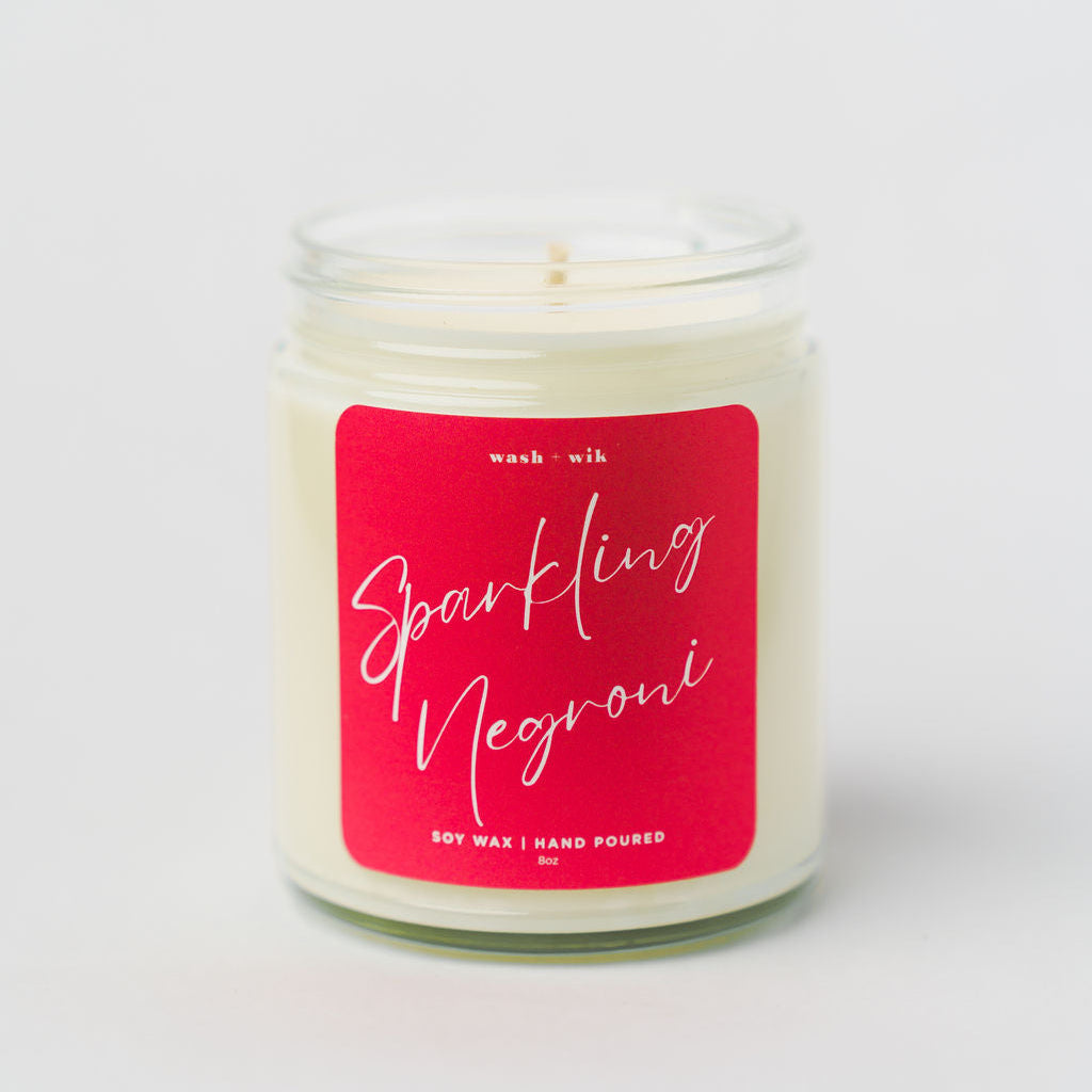 Candle with a red label on a white background