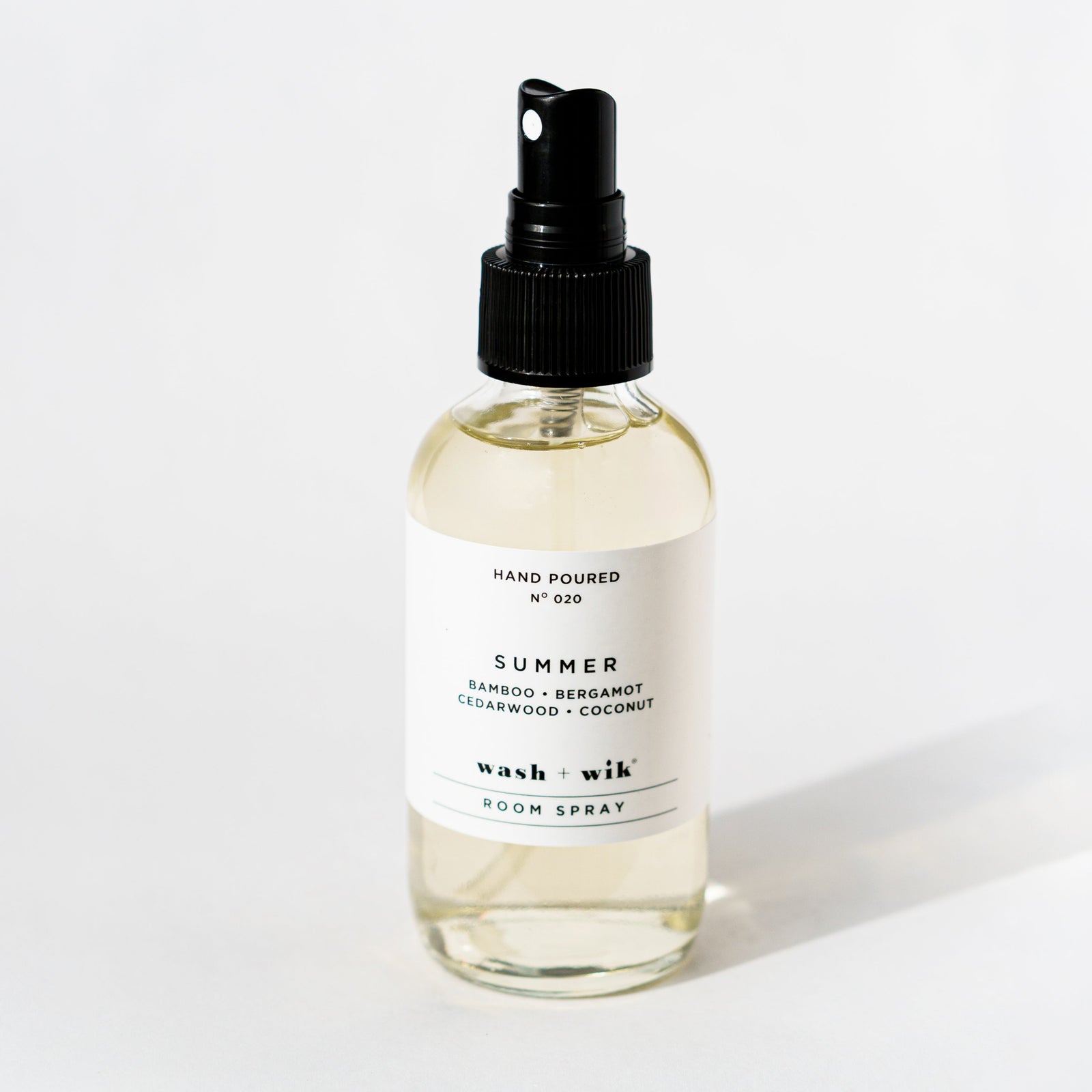 Clear room spray bottle on a white background 