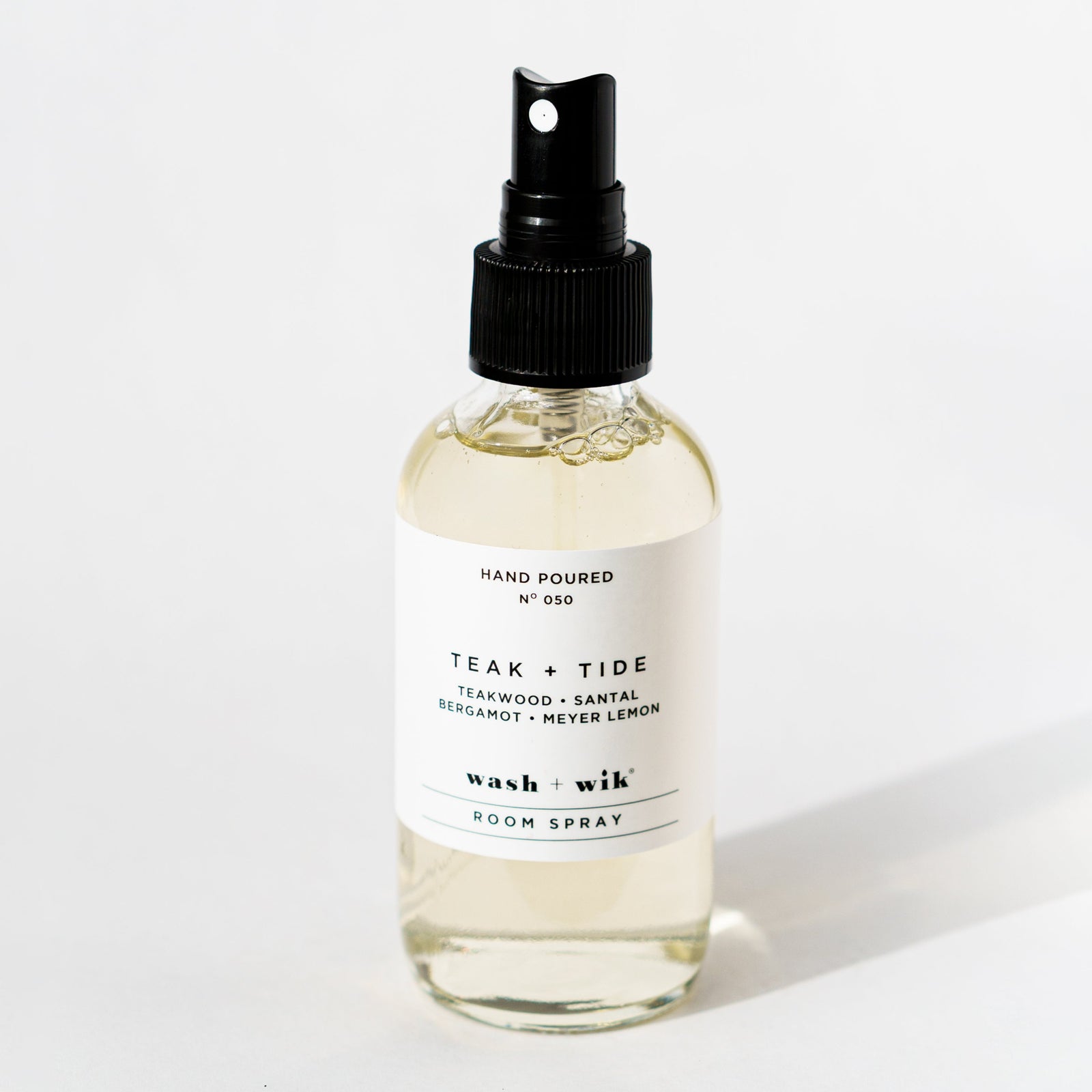 Clear room spray bottle on a white background 
