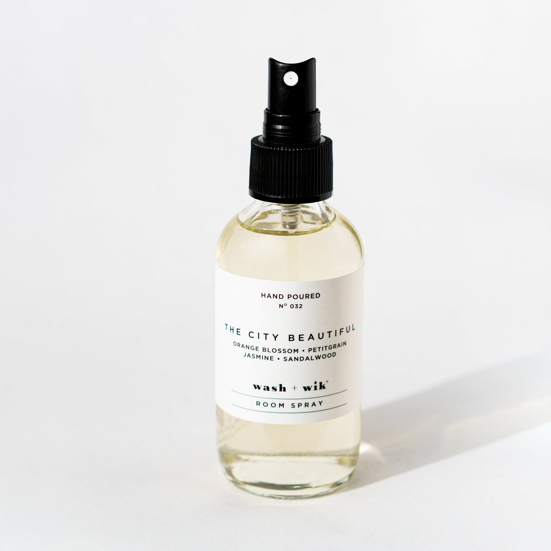 Clear room spray bottle on a white background 