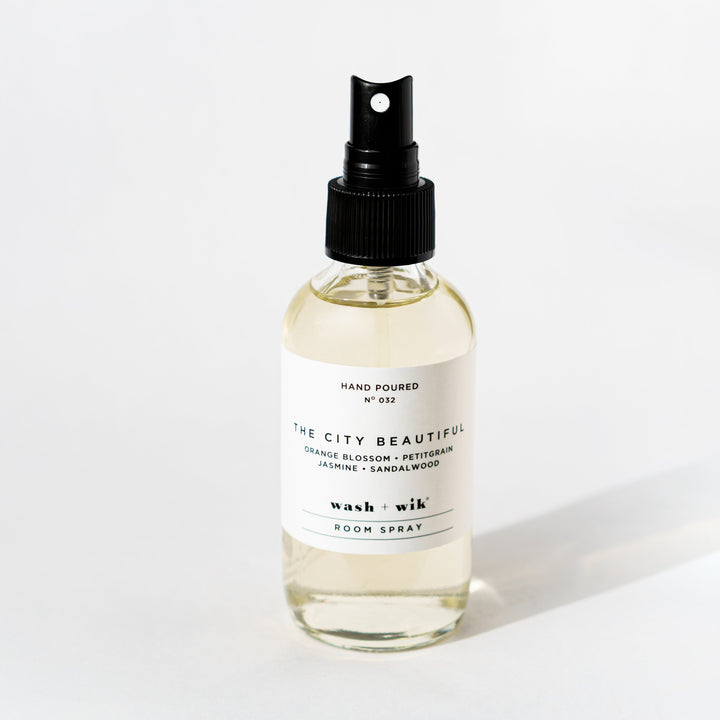 Clear room spray bottle on a white background 