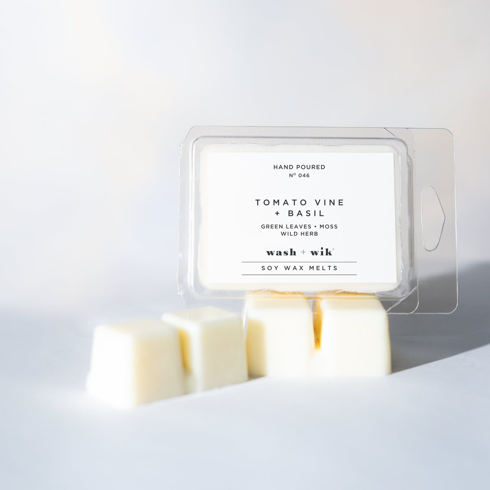 Wax melt packaging labeled 'Tomato Vine and Basil' on a white background