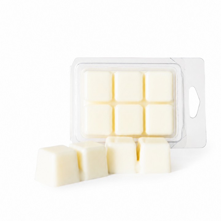 Wax melts in a clear packaging on a white background