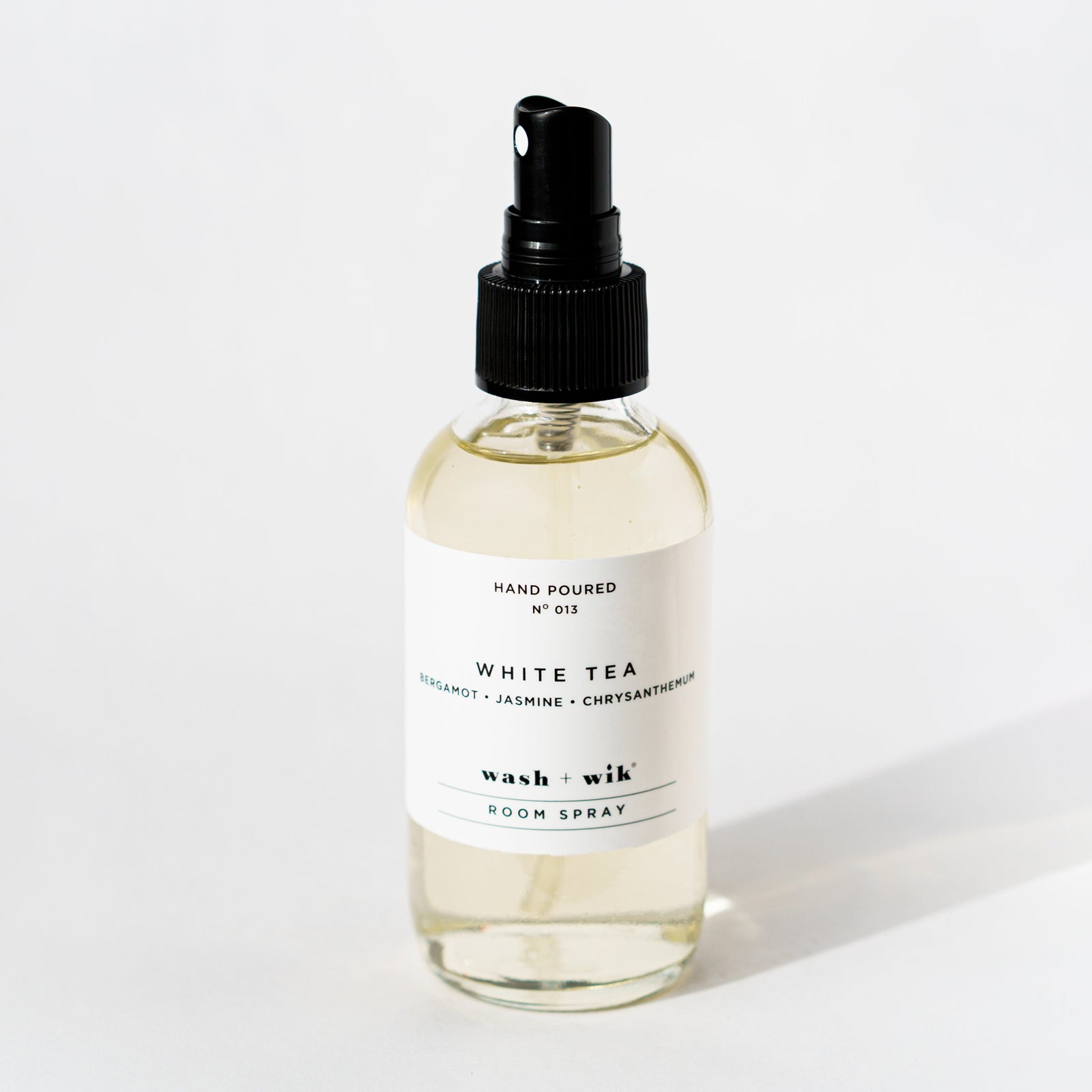 Clear room spray bottle on a white background 
