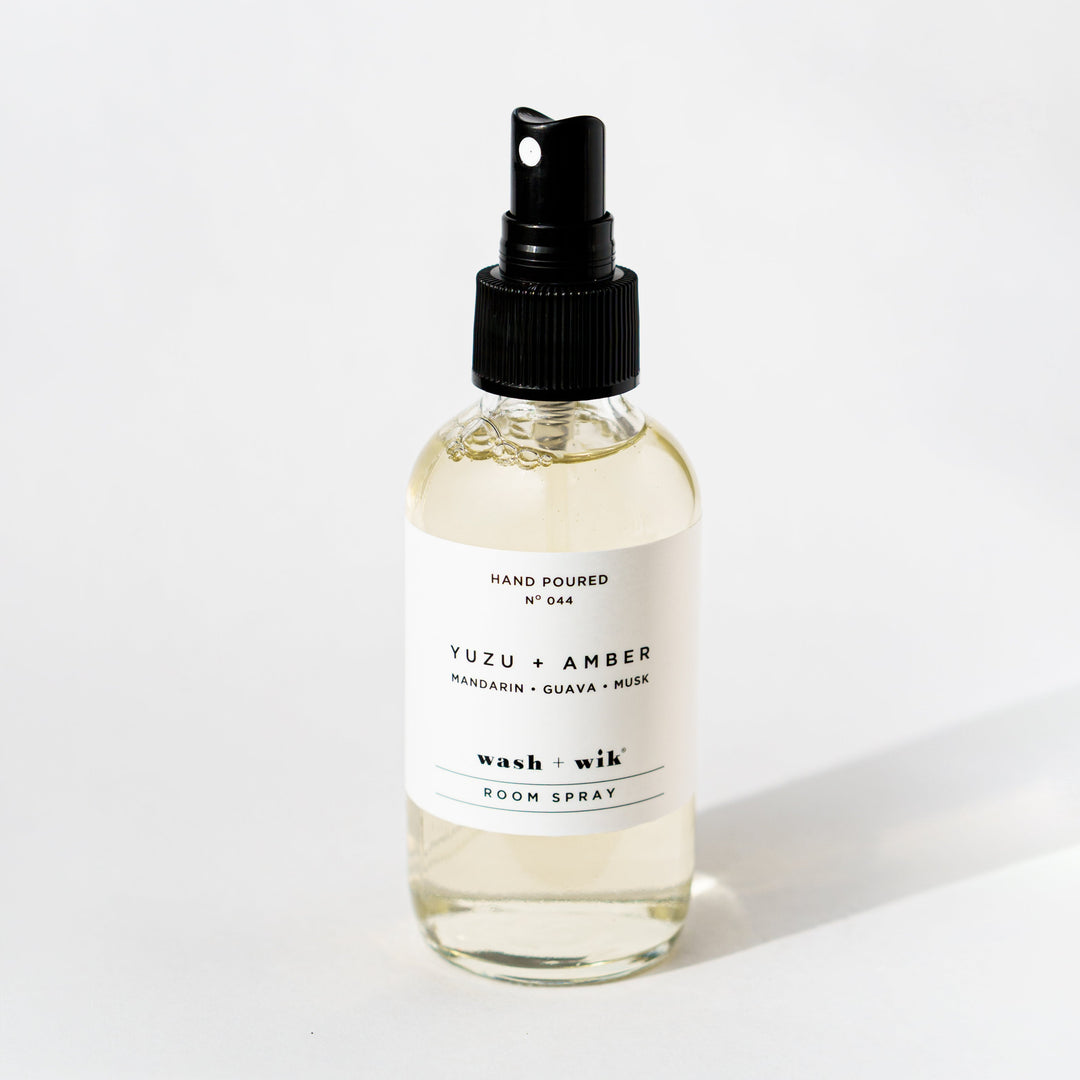 Clear room spray bottle on a white background 