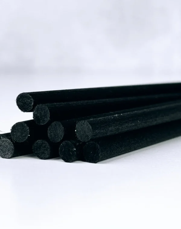 A bunch of black rods are stacked on top of each other