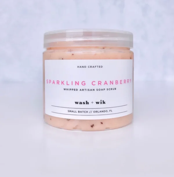 A jar of candle with the words " sparkling cranberry ".