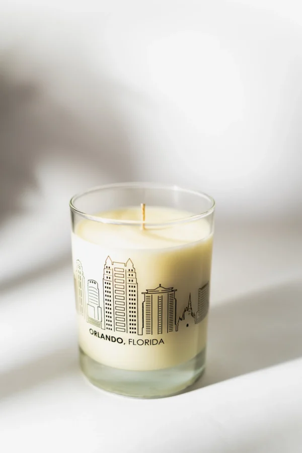 A candle that is sitting on top of a glass.